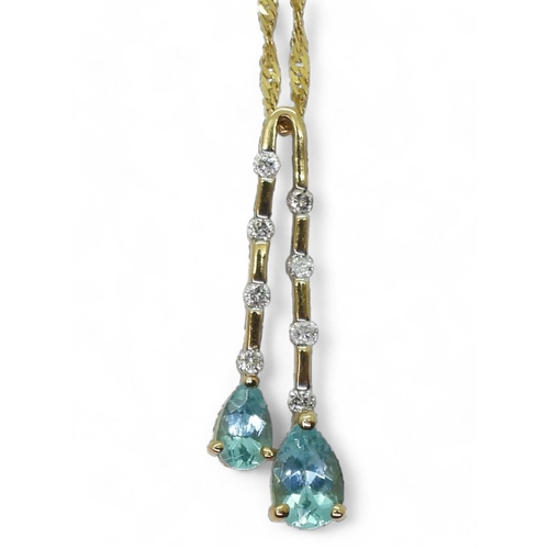 734 - A 9k gold blue gem and diamond pendant on a 45cm rope chain, weight 1.8gms