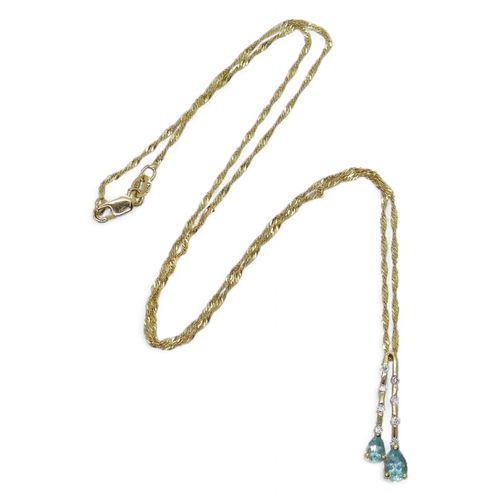 734 - A 9k gold blue gem and diamond pendant on a 45cm rope chain, weight 1.8gms