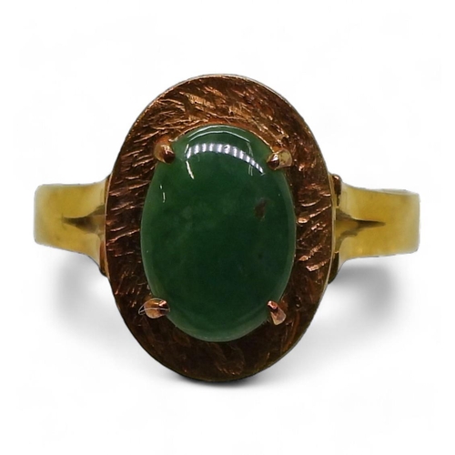 735 - A 14k gold Chinese green hardstone ring, size L1/2, weight 3gms