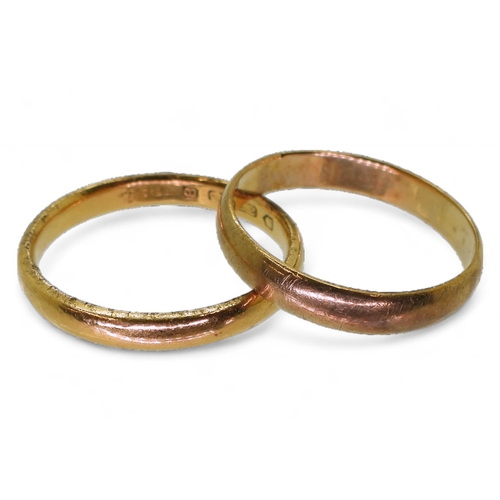 745 - A 22ct gold wedding ring, size U, weight 4.4gms, together with a 9ct example, size T1/2, weight 2.2g... 