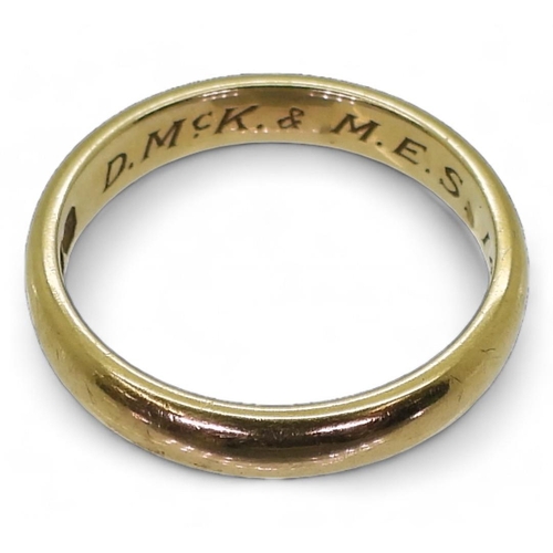 750 - An 18ct gold wedding ring with inscription to inner shank, size I1/2, weight 2.7gms