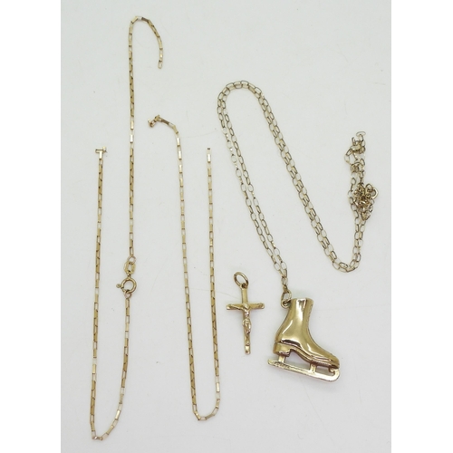 754 - A 9ct gold iceskate pendant, together with a 9ct crucifix both on (af) 9ct chains, weight together 5... 