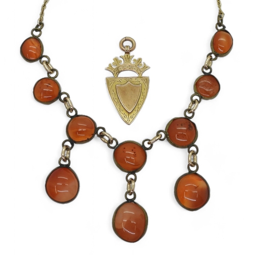 765 - A 9ct gold medallion, together with a carnelian necklace, with a partial yellow metal rope chain, we... 