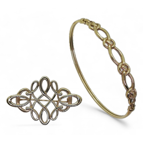 767 - A 9ct gold Ola Gorie knotwork brooch and a similar bangle, weight together 12.5gms In original Ola G... 