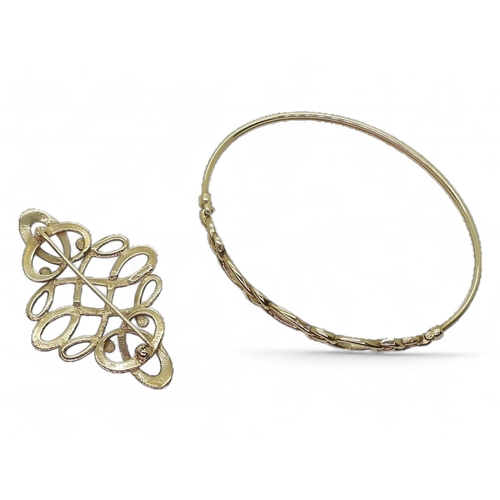 767 - A 9ct gold Ola Gorie knotwork brooch and a similar bangle, weight together 12.5gms In original Ola G... 