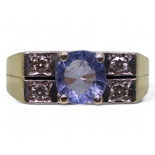 784 - A 14k yellow and white gold ring set with a sapphire and estimated approx 0.20cts of brilliant cut d... 