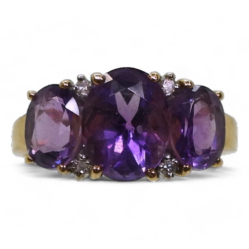 786 - A 9ct gold amethyst and diamond accent ring, size R1/2, weight 3.4gms