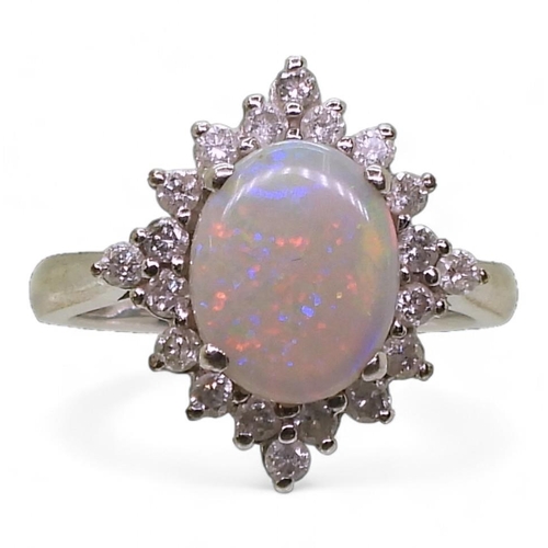 793 - A 9ct white gold opal and diamond cluster ring, set with estimated approx 0.30cts. opal approx 10.1m... 