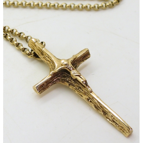 800 - A 9ct gold crucifix pendant, length 4.2cm and 62cm long chain, weight 15.5gms