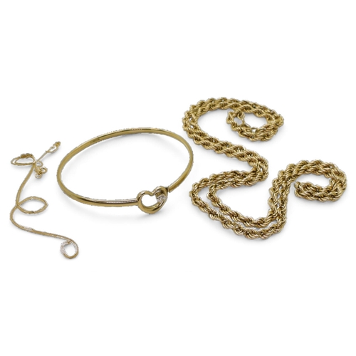 813 - A 64cm 9ct gold rope chain, a 9ct gold heart motif cz set bangle and a broken chain weight all toget... 