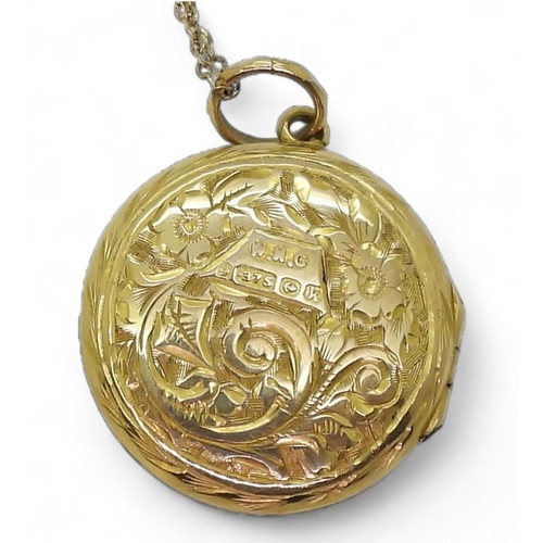 819 - A 9ct gold engraved locket hallmarked Birmingham 1909, diameter 2cm, length of chain 44cm, weight to... 