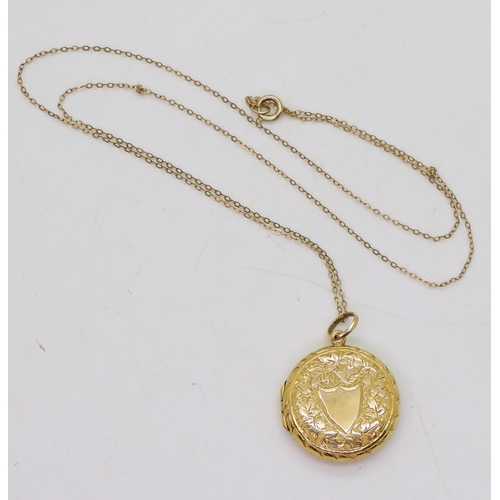 819 - A 9ct gold engraved locket hallmarked Birmingham 1909, diameter 2cm, length of chain 44cm, weight to... 