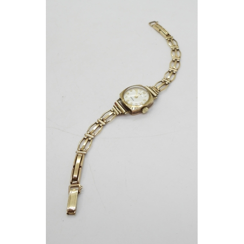 831 - A 9ct gold Roamer ladies watch and strap, weight including mechanism 11.8gms