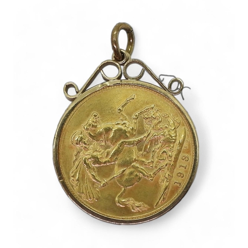 833B - A 1913 gold full sovereign in a yellow metal pendant mount, weight all together 8.9gms