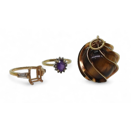 833C - A yellow metal mounted tiger's eye sphere pendant, a 9ct amethyst and diamond ring size M1/2, and a ... 