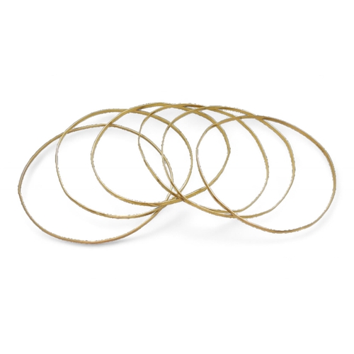 834B - Six 9ct gold bangles weight all together 14.6gms, together with four 9ct clasps weight 2.7gms and a ... 