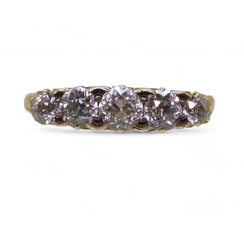 837 - A bright yellow metal scrolled mount ring set with five old cut diamonds, with an estimated approx d... 