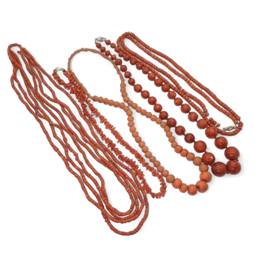 840 - Four coral beaded necklaces, together with a further red bead example, possibly red jasper