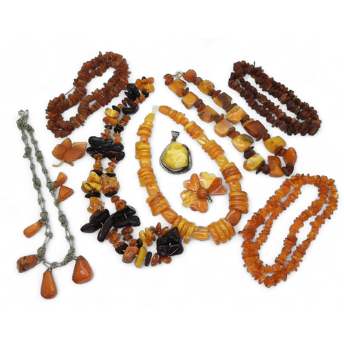 841 - Collection of Amber jewellery, including a silver mounted example, various beaded necklaces and othe... 