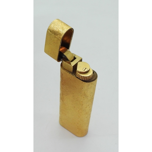 844 - A Gold plated lighter, marked 'Le Must de Cartier', with original box, paperwork and guarantee, toge... 