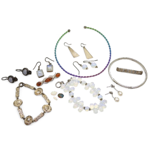 859 - A rainbow titanium torc necklet, a 'Hot Diamonds' silver bangle, a silver Shipton & Co Viking lo... 