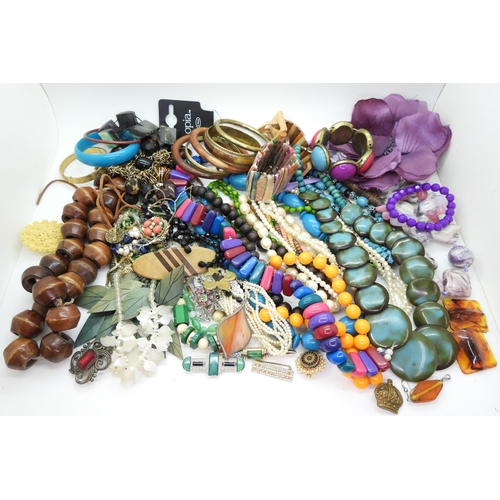 896 - A large quantity of costume jewellery, including multiple beaded necklaces, earrings, brooches and o... 