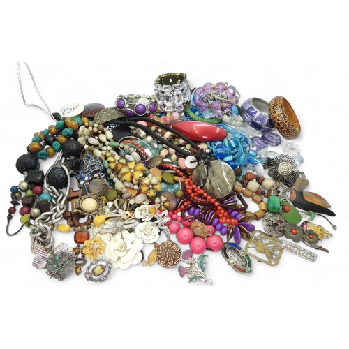 899 - A large quantity of costume jewellery, including multiple beaded necklaces, earrings, brooches, and ... 