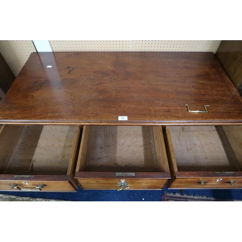 13 - A 19th century mahogany three over three chest of drawers with brass drawer pulls on splayed bracket... 