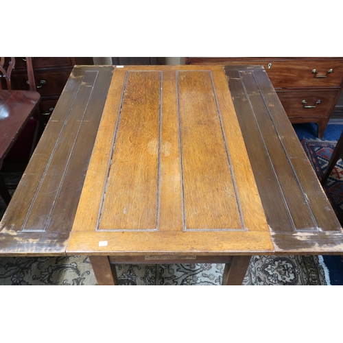 14 - An early 20th century oak Arts & Crafts pull out kitchen table on square tapering supports, 76cm... 