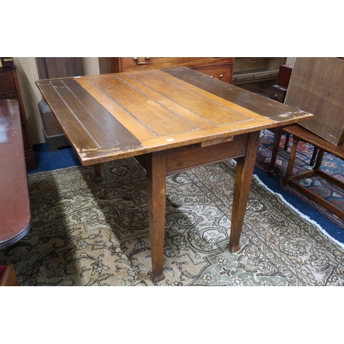 14 - An early 20th century oak Arts & Crafts pull out kitchen table on square tapering supports, 76cm... 