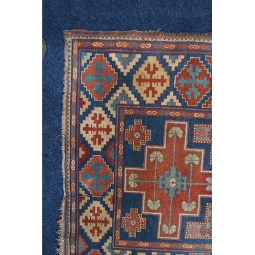 17 - A blue ground Balouch rug with multi-coloured geometric patterned ground within multi-coloured borde... 