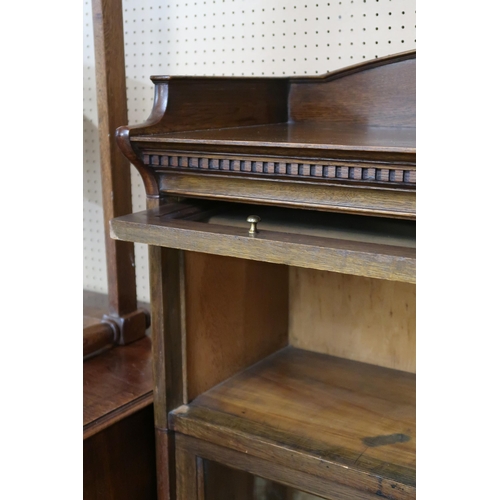 18 - A 20th century oak four tier sectional bookcase with glazed fall front doors, 153cm high x 88cm wide... 