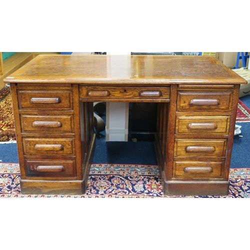 2 - An early 20th century oak Globe Wernicke pedestal desk with central drawer flanked by four drawer pe... 