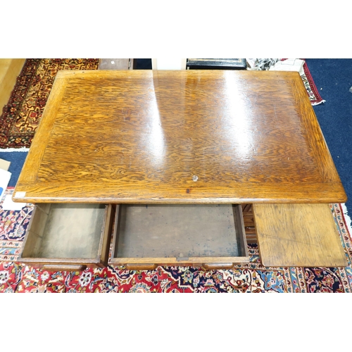 2 - An early 20th century oak Globe Wernicke pedestal desk with central drawer flanked by four drawer pe... 