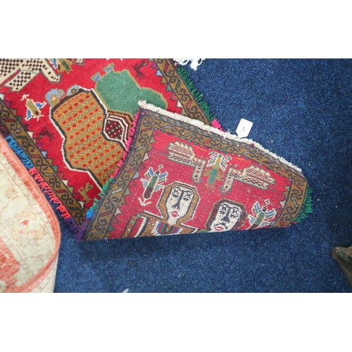 21 - A lot comprising a red ground Tribal style rug with figural designed ground within multicoloured fri... 