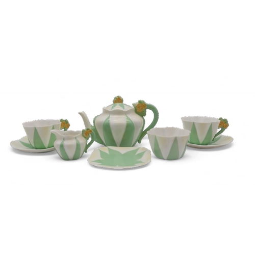 A Shelley tea for two, the handles with moulded yellow flowers and the body with ribbed detail on green and white ground, comprising teapot, milk jug, sugar bowl, two cups and saucers and a plate, pattern number 11993/9