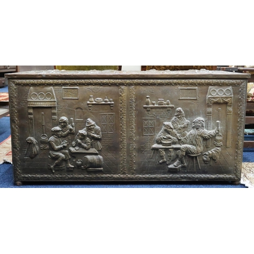 23 - An early 20th century blanket chest decoratively embossed with tavern scenes, 57cm high x 116cm wide... 