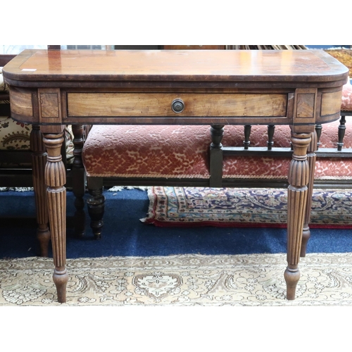 25 - A 19th century mahogany and walnut veneered single drawer fold over tea table on turned supports, 74... 