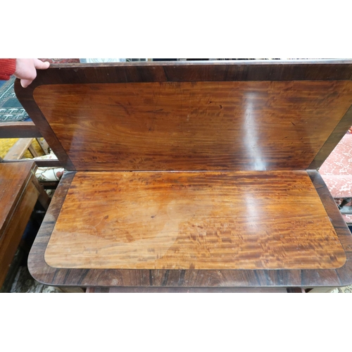 25 - A 19th century mahogany and walnut veneered single drawer fold over tea table on turned supports, 74... 