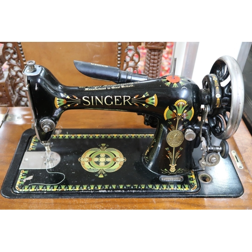 26 - A 20th century mahogany cased Singer parlour sewing machine, 79cm high x 81cm wide x 45cm deep