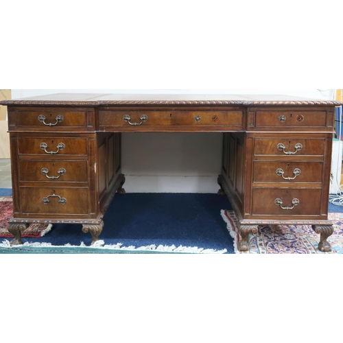 31 - A large early 20th century mahogany pedestal desk with embossed leather skiver over long central dra... 