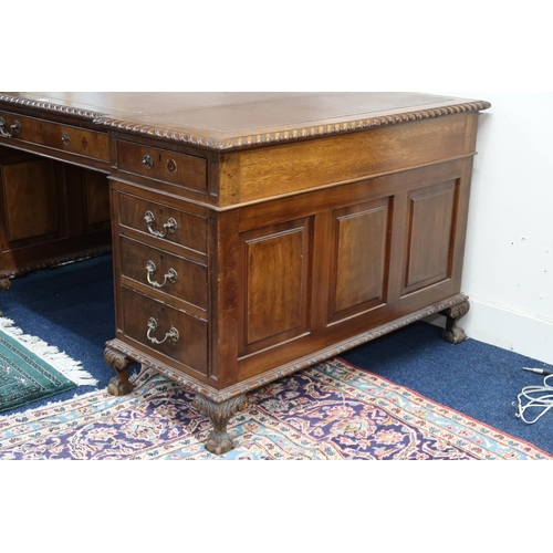 31 - A large early 20th century mahogany pedestal desk with embossed leather skiver over long central dra... 