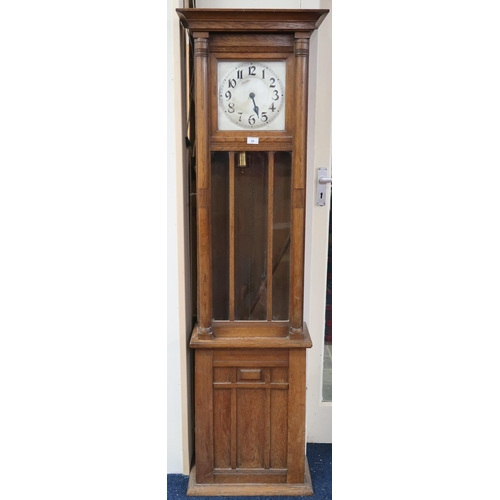 33 - A 20th century oak longcase clock with silver tone face bearing Arabic numerals, 173cm high