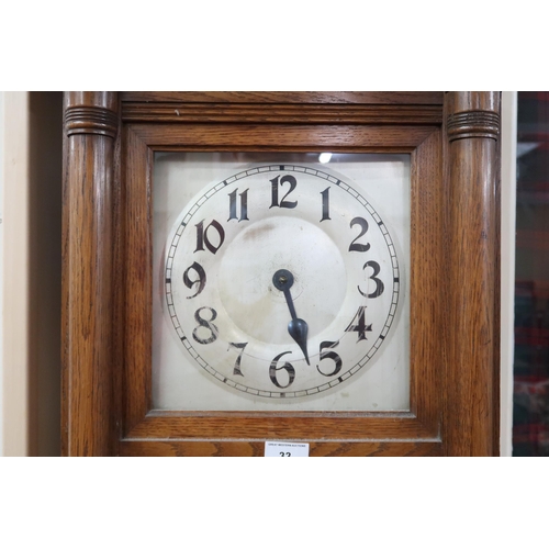 33 - A 20th century oak longcase clock with silver tone face bearing Arabic numerals, 173cm high