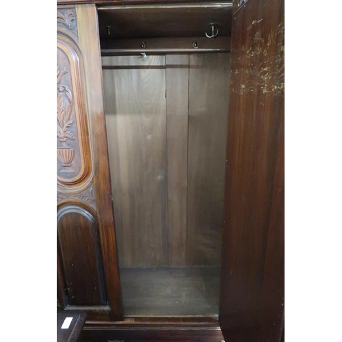 39 - A Victorian mirror doored wardrobe with moulded cornice over bevelled glass mirror door over single ... 