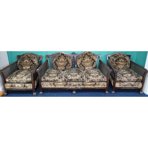 4 - A late Victorian mahogany framed three piece bergere suite with Damask upholstered cushions two seat... 