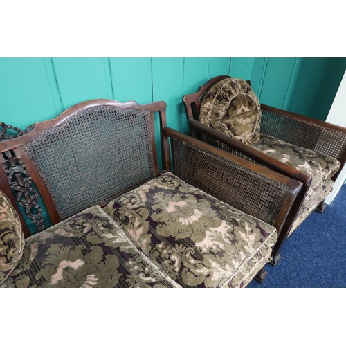 4 - A late Victorian mahogany framed three piece bergere suite with Damask upholstered cushions two seat... 