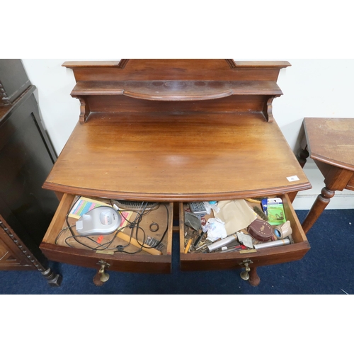 46 - An early 20th century mahogany bow fronted hall table with shelved gallery back over two drawers on ... 