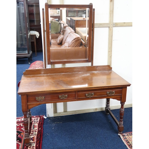 49 - A late Victorian mahogany dressing table with adjustable bevelled glass mirror over two drawers on t... 