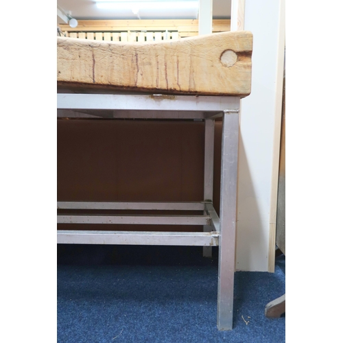 52 - A 20th century pine heavy butchers block on aluminium base, 83cm high x 137cm wide x 61cm deep